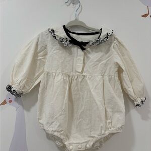 Cream Baby Romper with Black Trim
